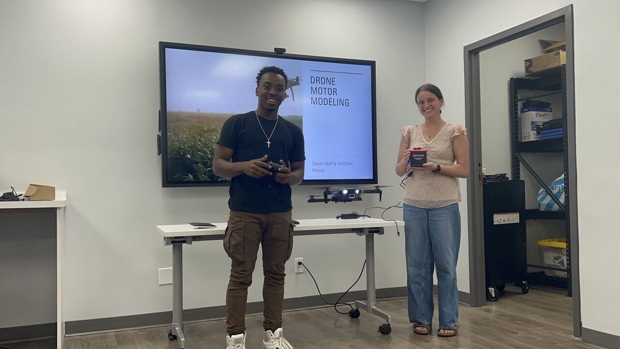 Students presenting a drone motor modeling project