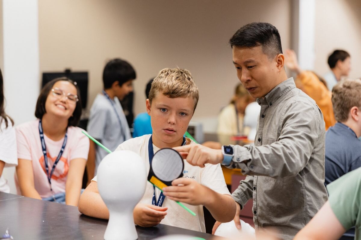 Dr. Terry Weng teaching a young participant during PBA's Summer Science Camp